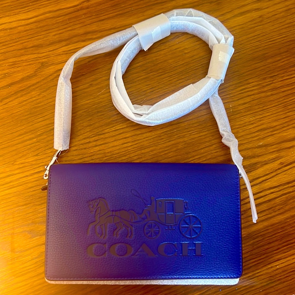 Blue mini original coach bag value of 320$